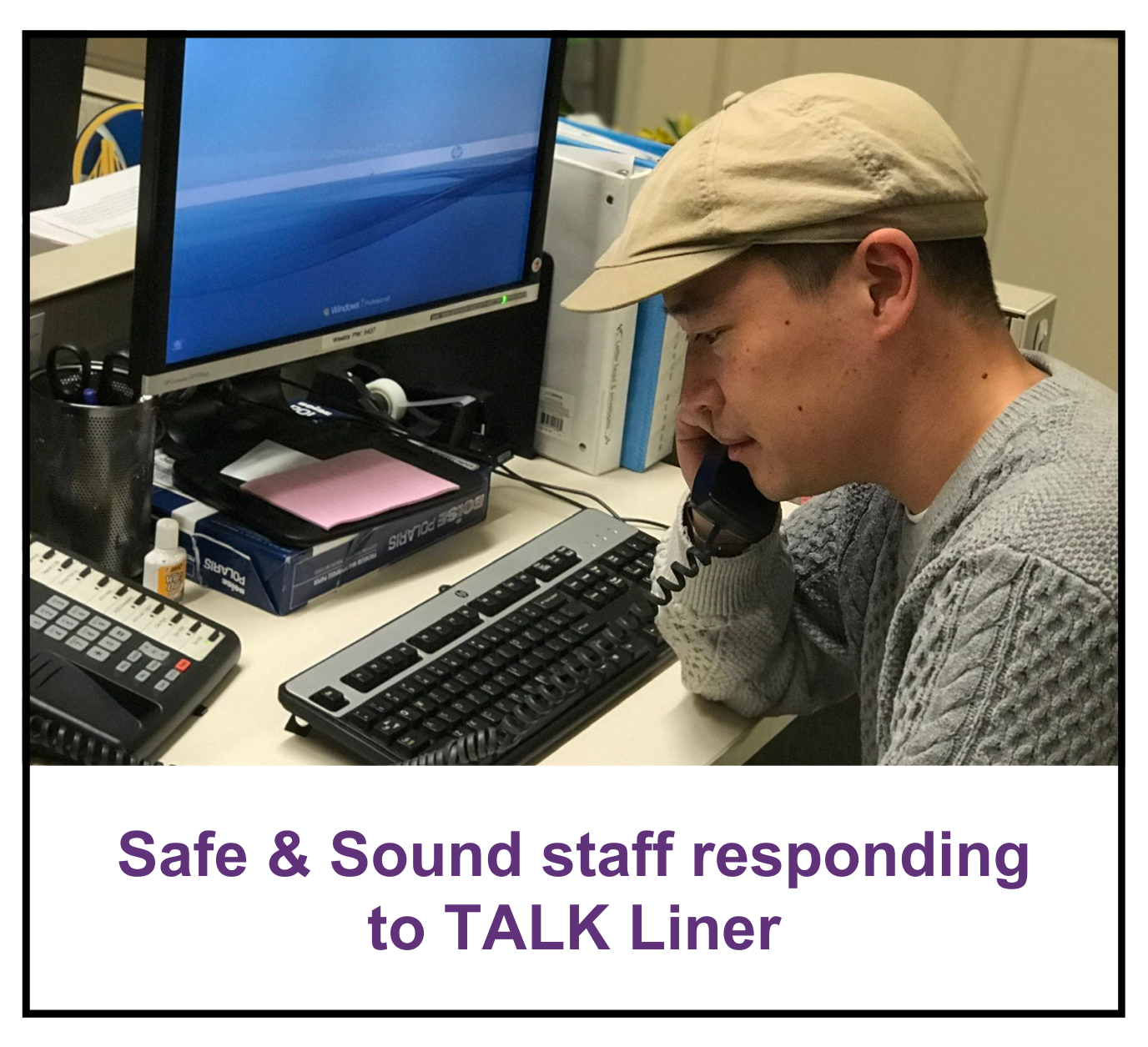 Safe & Sound staff speaking on the phone to someone who has called the TALKLine
