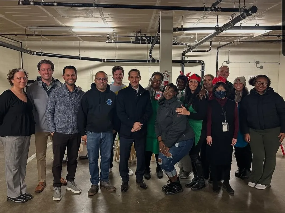 Mayor Daniel Lurie at Safe & Sound's Bayview Office garage with colleagues and volunteers