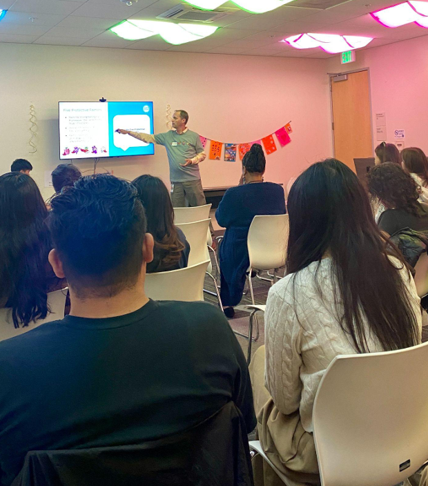 Malcom Gaines, Senior Clinical Project Director, at the front of a workshop run by Communities of Care