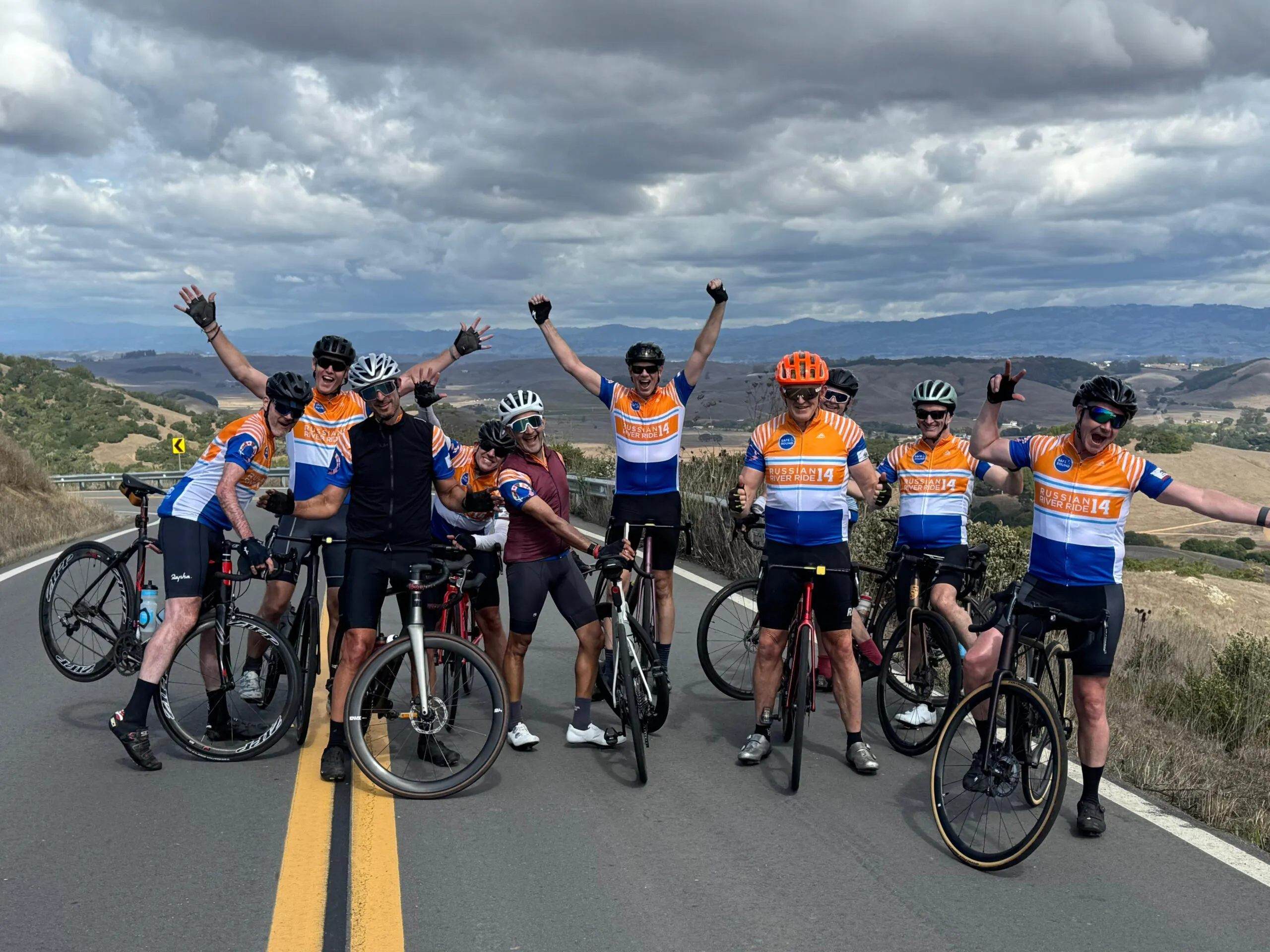 A group of 10 men on bicycles